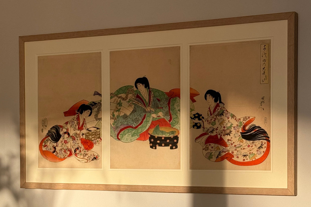 Japanese woodblock triptych framed by Bermondsey Gallery in a natural oak frame, hanging in a customer's sunlit living room
