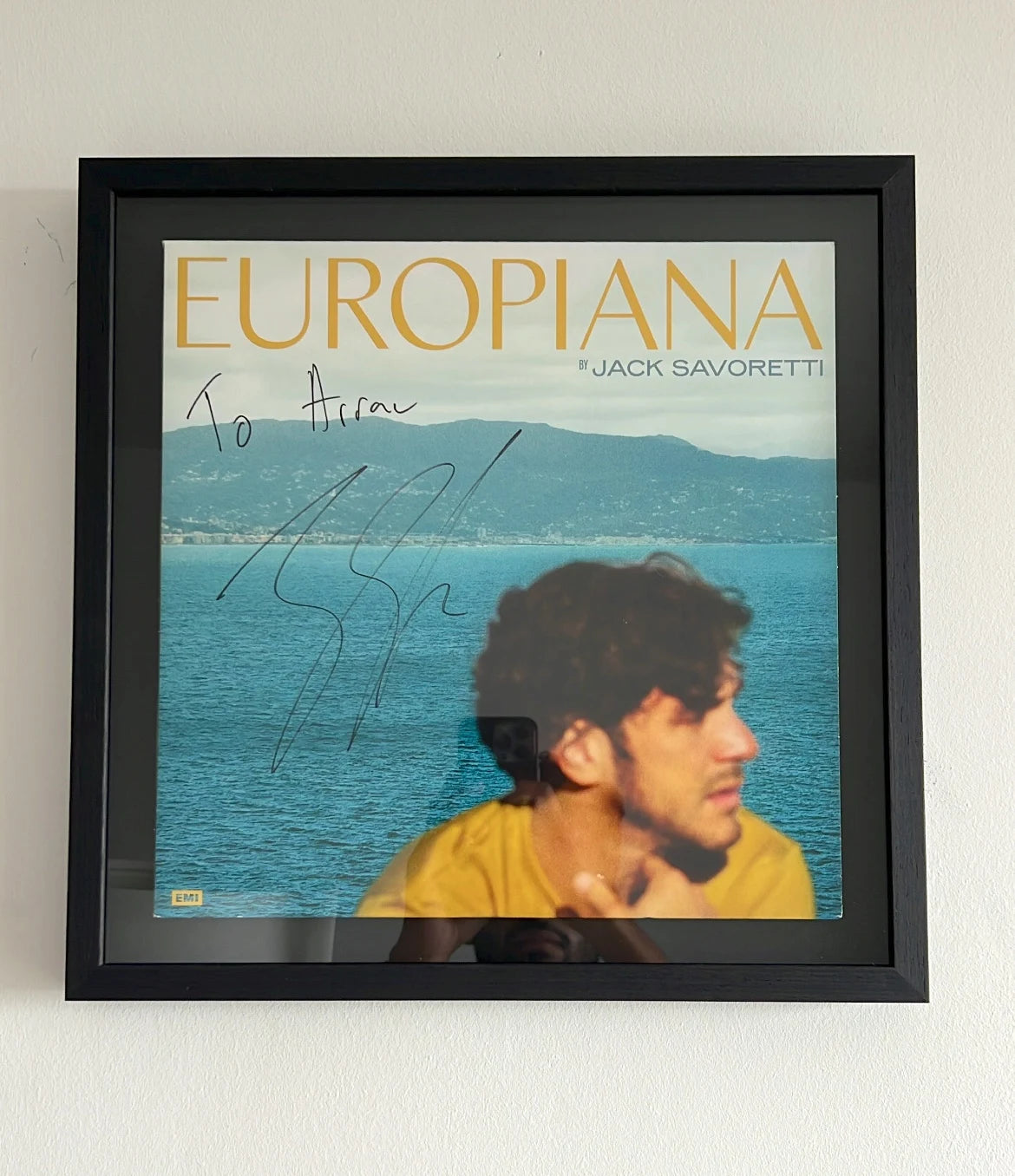 Signed album art in natural oak frame